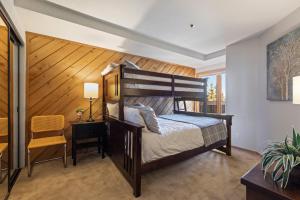 a bedroom with a bed and a desk and a chair at K B M Resorts NEW LISTING Ski Access to Deer Valley slopes Common Hot Tub Parking in Silver Lake Deer Valley in Park City