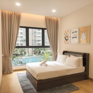 a bedroom with a bed and a large window at seaviews beach 9b 4-13pax ciq ksl johor bahru in Johor Bahru