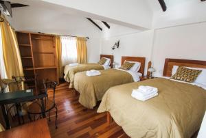 Ένα ή περισσότερα κρεβάτια σε δωμάτιο στο Wilkamayu Hotel