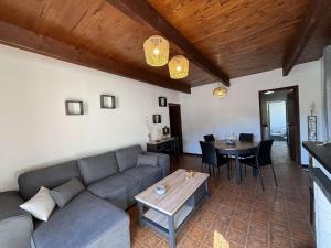 a living room with a couch and a table at Appartement Alata, 3 pièces, 4 personnes - FR-1-61-628 in Alata