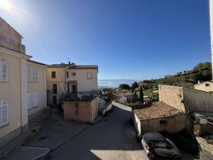 a view of a street with buildings and a car at Appartement Alata, 3 pièces, 4 personnes - FR-1-61-628 in Alata