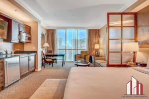 a large room with a kitchen and a living room at MGM Signature-23-811 F1 Track & Strip View Studio in Las Vegas