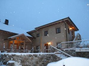 a large wooden house with snow on it at Pleasant apartment in Naturns in Naturno
