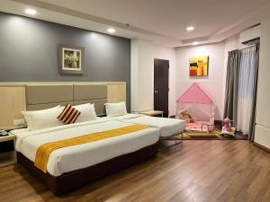 Postel nebo postele na pokoji v ubytování Hotel Sentral Riverview Melaka + 37 fotografií