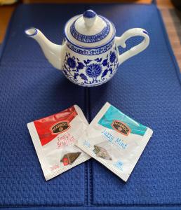 a table with a teapot and two packets of tea at ChillOut in Cheung Chau in Hong Kong