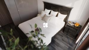 Ένα ή περισσότερα κρεβάτια σε δωμάτιο στο de Heidis Apartment