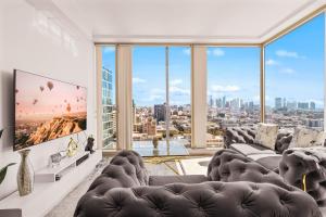 a living room with a view of a city at Beautiful 2 BR Sky View Apartment in Los Angeles
