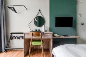 Tempat tidur dalam kamar di Chill Style Inn