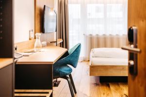 Televisi dan/atau pusat hiburan di Sonne 1806 - Hotel am Campus Dornbirn