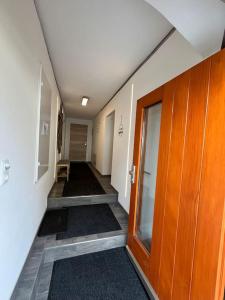 an empty hallway with stairs in an office building at Meranerhof in Julbach