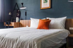 Tempat tidur dalam kamar di Chill Style Inn