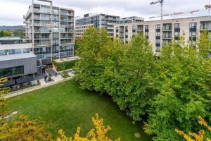 a park in the middle of a city with buildings at Spacious 1BR APT, 8 mins to Old Parliament House in Kingston 