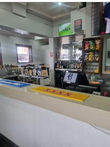 a counter in a fast food restaurant with a counter sidx sidx at Commercial Hotel Young in Young
