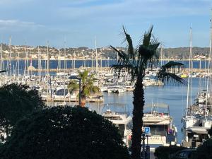 a view of a marina with boats in the water at Maison à la Naronne in Bandol