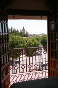 a view from an open door of a balcony at Hostal Santa Barbara in Socuéllamos