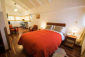 Ένα ή περισσότερα κρεβάτια σε δωμάτιο στο Wilkamayu Hotel