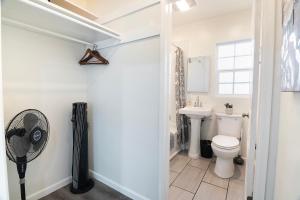 a bathroom with a toilet and a sink at Chic Studio Sleeps 4 Beverly Hills Adj in Los Angeles