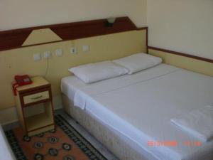 Postel nebo postele na pokoji v ubytování Red Rose Hotel + 18 fotografií
