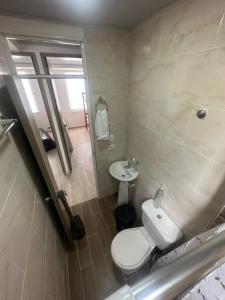 a bathroom with a toilet and a sink at Ibague cowork in Ibagué