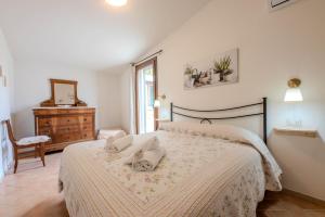 Posteľ alebo postele v izbe v ubytovaní Agriturismo Diaccia Botrona