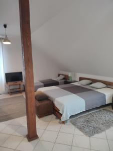 Postel nebo postele na pokoji v ubytování pokoje do wynajecia