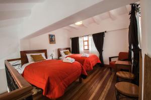 Ένα ή περισσότερα κρεβάτια σε δωμάτιο στο Wilkamayu Hotel