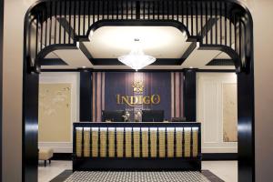a lobby of an indigo store with a sign on the wall at Indigo Boutique Hotel in Cao Bằng