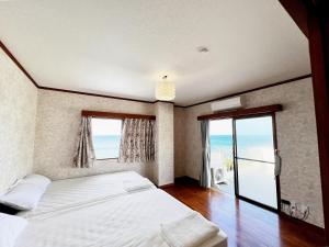 Voodi või voodid majutusasutuse 秘境の楽園 Cocos Harbor 奄美 toas