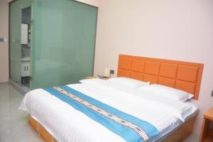 Hongge Hotel - Harbin Taiping Airport客房内的一张或多张床位