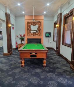 a billiard room with a pool table in it at Commercial Hotel Young in Young