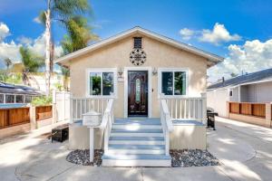 a house with a staircase leading to the front door at The Kozi Sandbox in Oceanside
