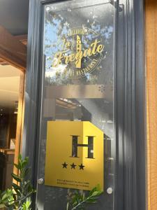a sign in a window of a barbie store at La Frégate in Collioure +26 photos