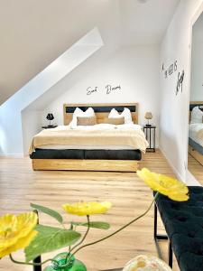 a bedroom with a king sized bed in a attic at Skyview Residence - Self Check In - Near City Centre in Graz