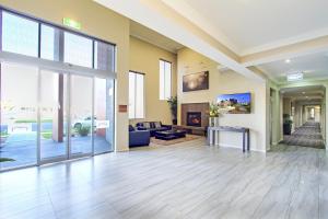 a large living room with a large glass door at Bridges on Argyle in Traralgon