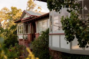 a house with windows on the side of it at Kate Owen Art House in Hobart