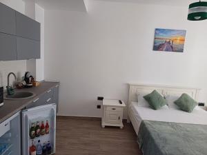 En eller flere senge i et værelse på Sunrise MV 15 + 12 billeder