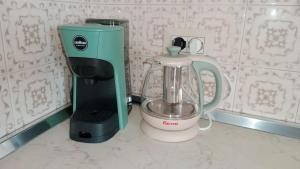 a blender sitting on a counter next to a mixer at SOFIA in Venice