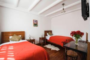 Ένα ή περισσότερα κρεβάτια σε δωμάτιο στο Wilkamayu Hotel
