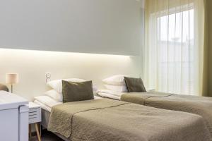 Giường trong phòng chung tại Bern Boutique by Rikas Hotels