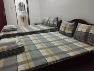 Postel nebo postele na pokoji v ubytování Sứ Lạng Hotel