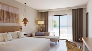 アデへにあるAluaSoul Costa Adejeのベッドルーム1室(ベッド1台付)、景色を望むベッドルーム1室が備わります。