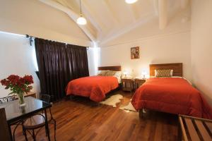 Ένα ή περισσότερα κρεβάτια σε δωμάτιο στο Wilkamayu Hotel