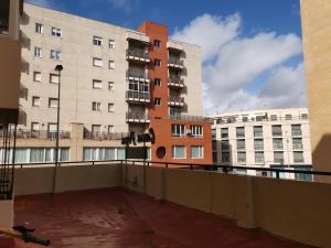 a view of a balcony of a building with buildings at MRZ RENTALS JEREZ in Jerez de la Frontera