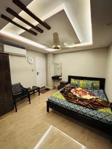 a bedroom with a bed in a room at Moven Inn Hotel Islamabad in Islamabad