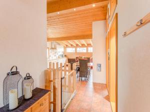 a hallway with a kitchen and a dining room at Urbane Apartment in Sankt Gallenkirch with Balcony in Sankt Gallenkirch