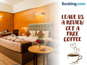 a hotel room with a bed and a sign saying leave us a review get at Hotel Asrani International in Secunderabad