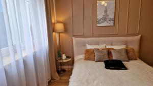 מיטה או מיטות בחדר ב-Atlas Design Apartment 2X