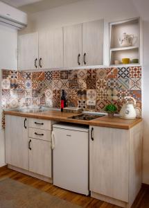 Kuchyň nebo kuchyňský kout v ubytování Delightful Studio Sara