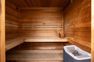 a sauna with a bench and a tub in it at Island Daze Surf Beach Phillip Island in Phillip Island