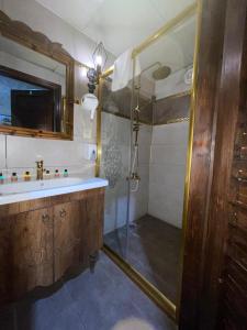 a bathroom with a shower and a sink at lariva konakları in Sanlıurfa